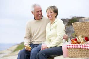 Older couple on the beach - family trust planning concept